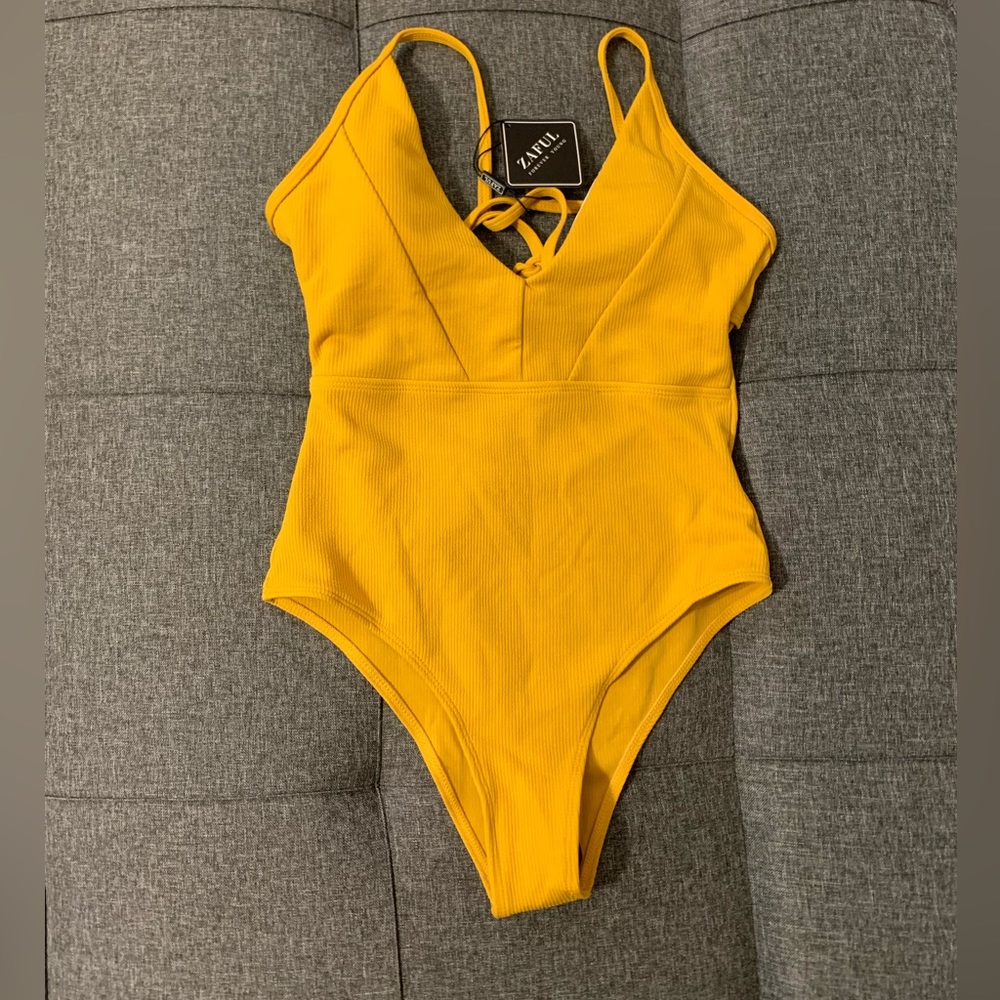Yellow one piece swimsuit with adjustable straps